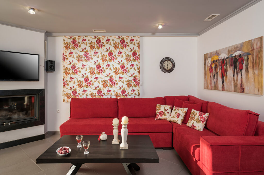 Spacious living room with fireplace at Villa Antonis villa rental, Crete